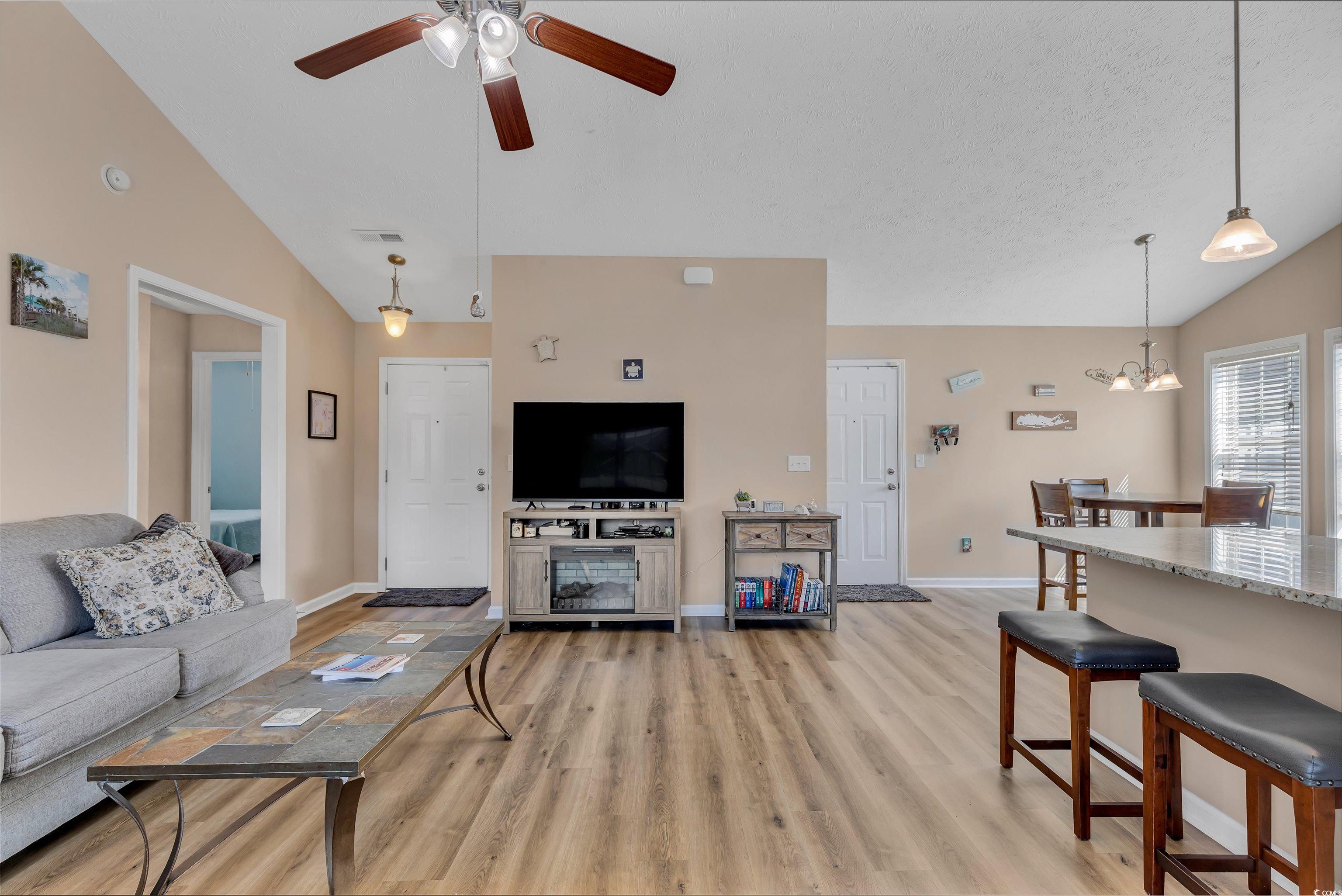 746 Bucklin Loop Myrtle Beach, SC 29579 - Photo 16 of 39 Living room featuring ceiling fan with notable cha