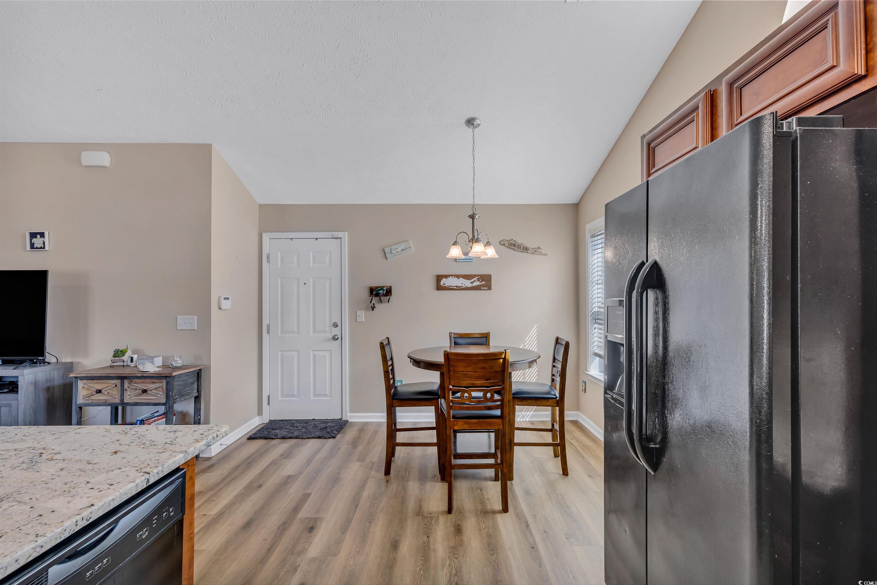 746 Bucklin Loop Myrtle Beach, SC 29579 - Photo 20 of 39 Dining room with light wood-type flooring, lofted