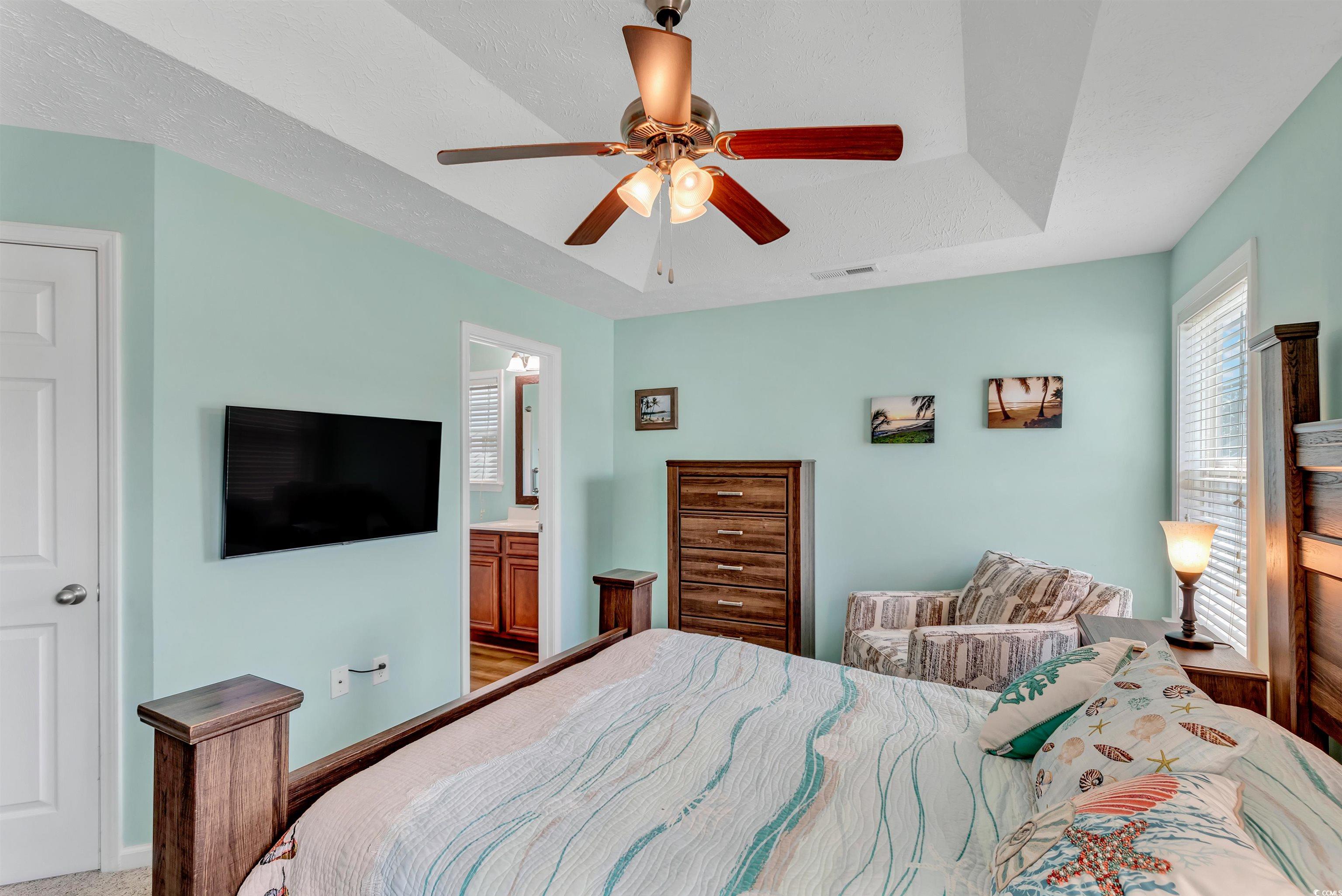 746 Bucklin Loop Myrtle Beach, SC 29579 - Photo 23 of 39 Bedroom featuring ceiling fan and ensuite bath