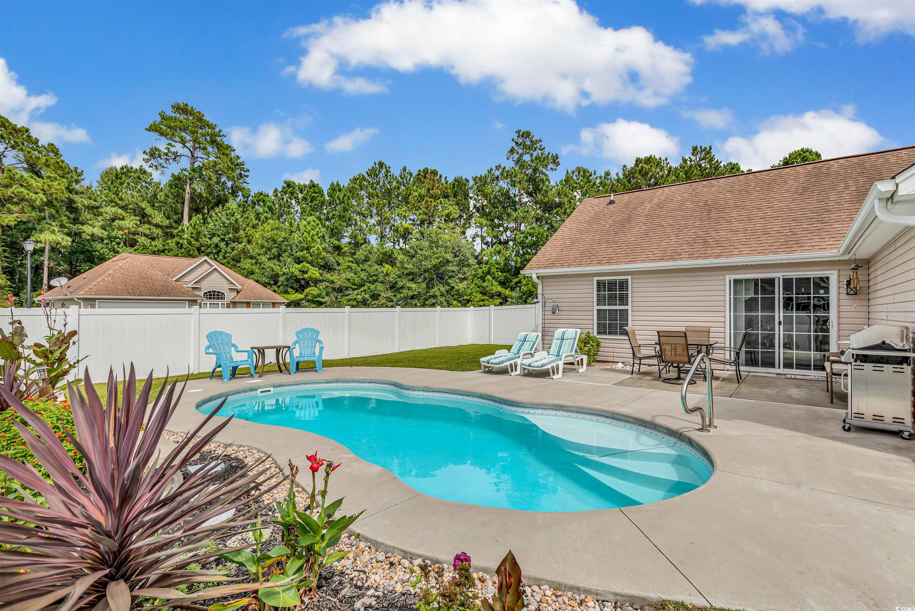 746 Bucklin Loop Myrtle Beach, SC 29579 - Photo 8 of 39 View of swimming pool with a patio area and grilli