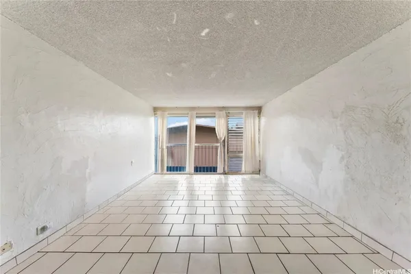 a view of kitchen with white cabinets