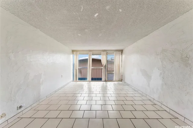 a view of kitchen with white cabinets