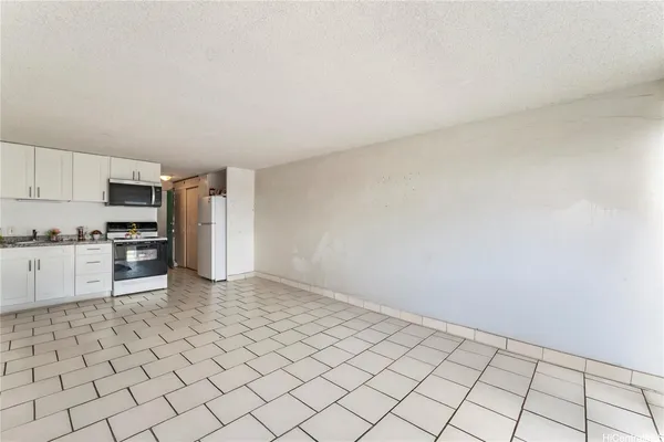 a kitchen with stainless steel appliances a refrigerator sink and cabinets