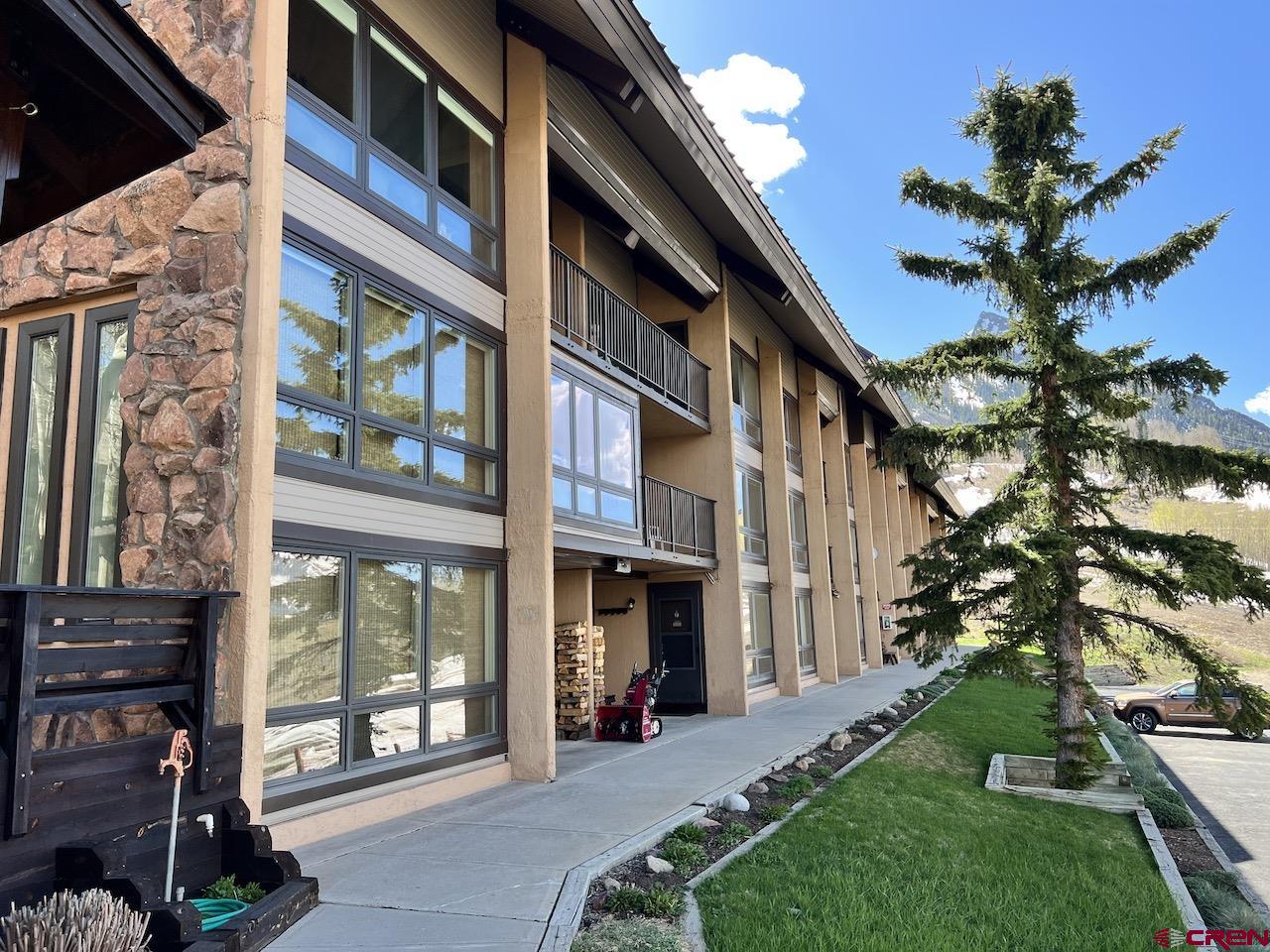 51 Whetstone Road, Unit 2306 Crested Butte, CO 81225 - Photo 42 of 44 a view of a building with a yard