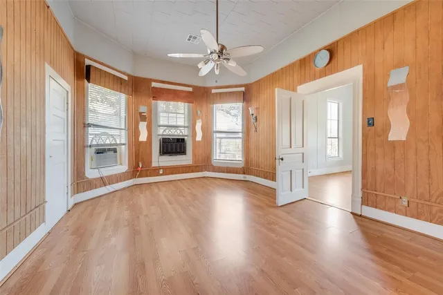 a view of an entryway with wooden floor and windows