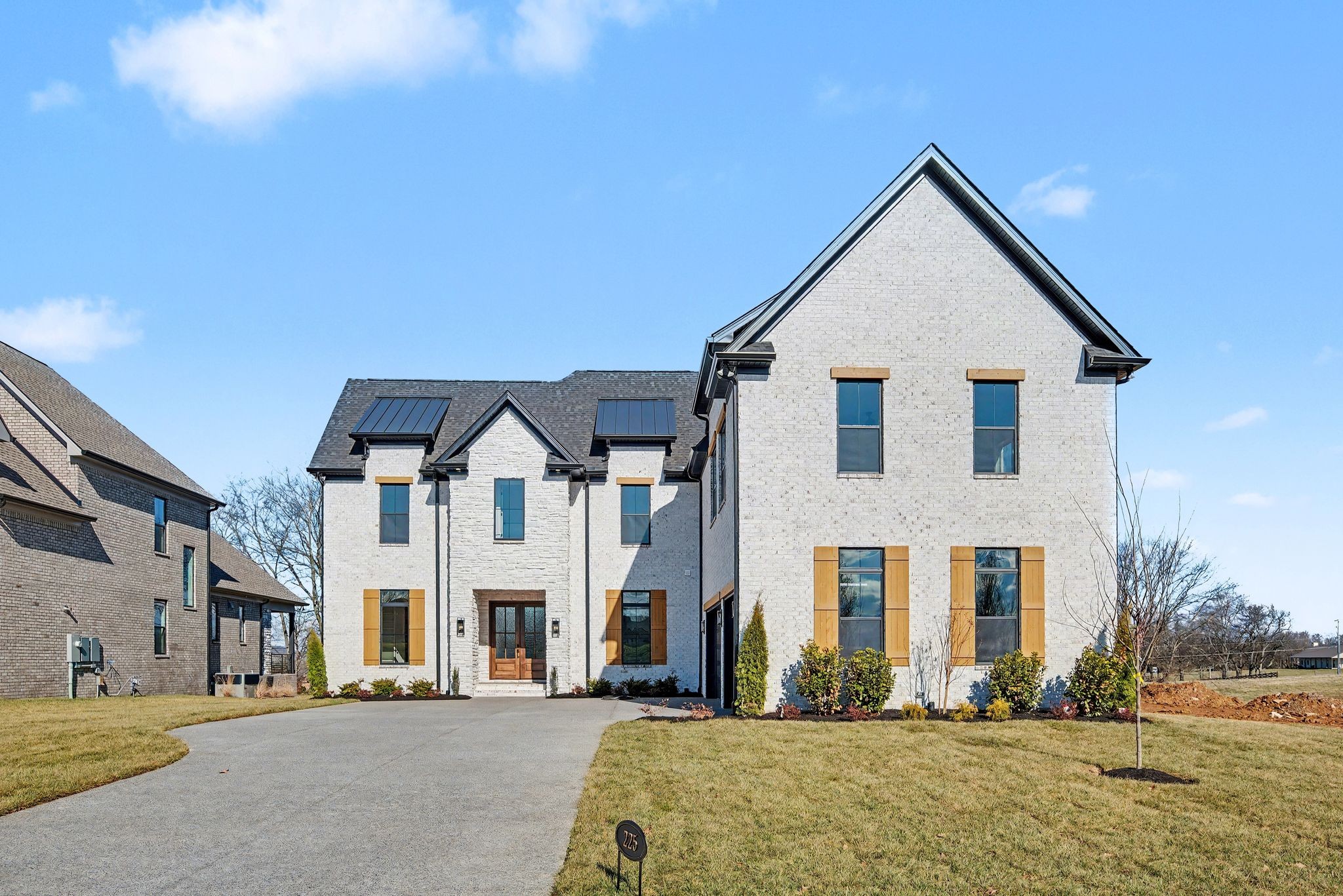 a front view of a house with a yard