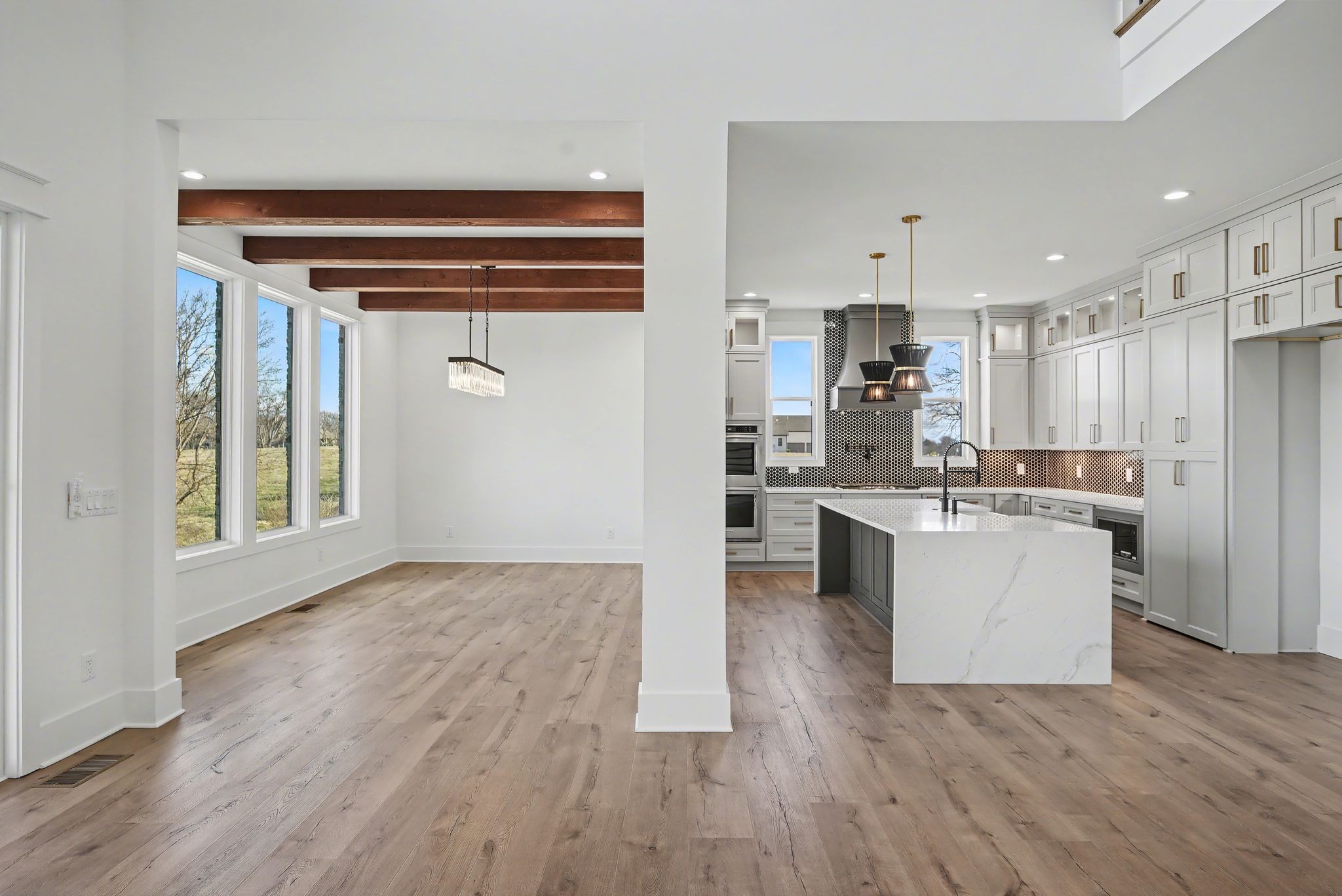 225 Bellsford Road Gallatin, TN 37066 - Photo 16 of 55 a kitchen with kitchen island wooden floors appliances and cabinets