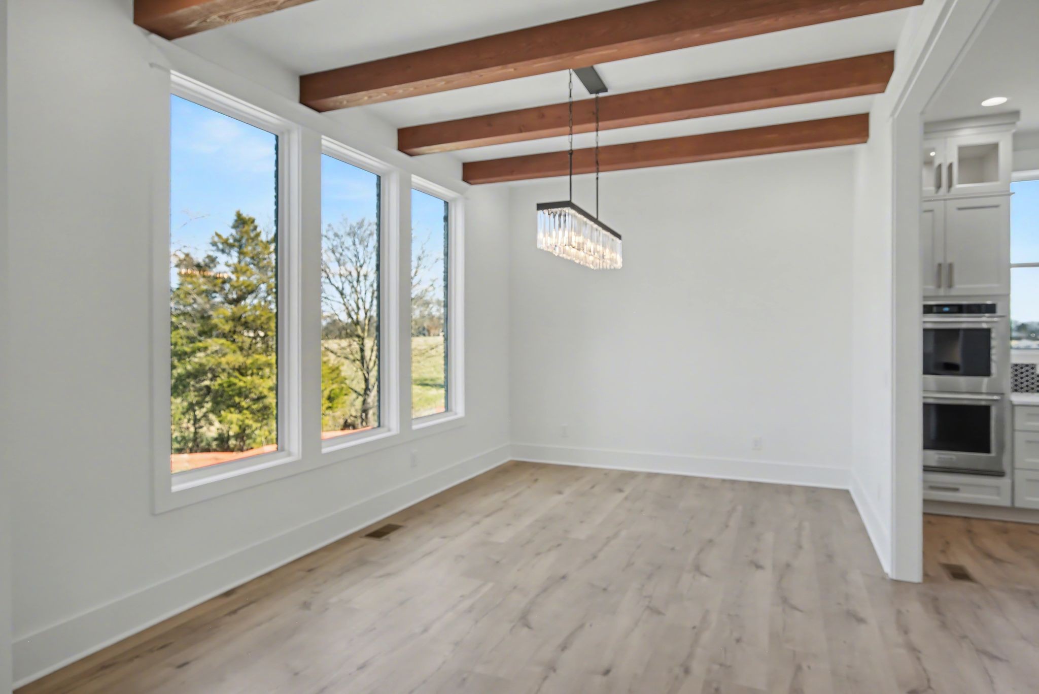 225 Bellsford Road Gallatin, TN 37066 - Photo 27 of 55 a view of an empty room with a window and hardwood floor