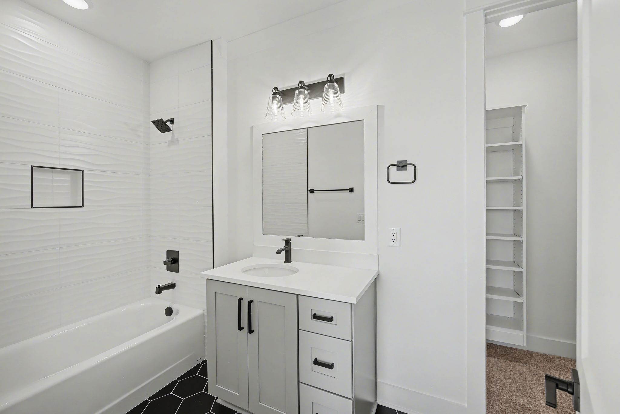 225 Bellsford Road Gallatin, TN 37066 - Photo 41 of 55 a bathroom with a bathtub sink vanity and mirror