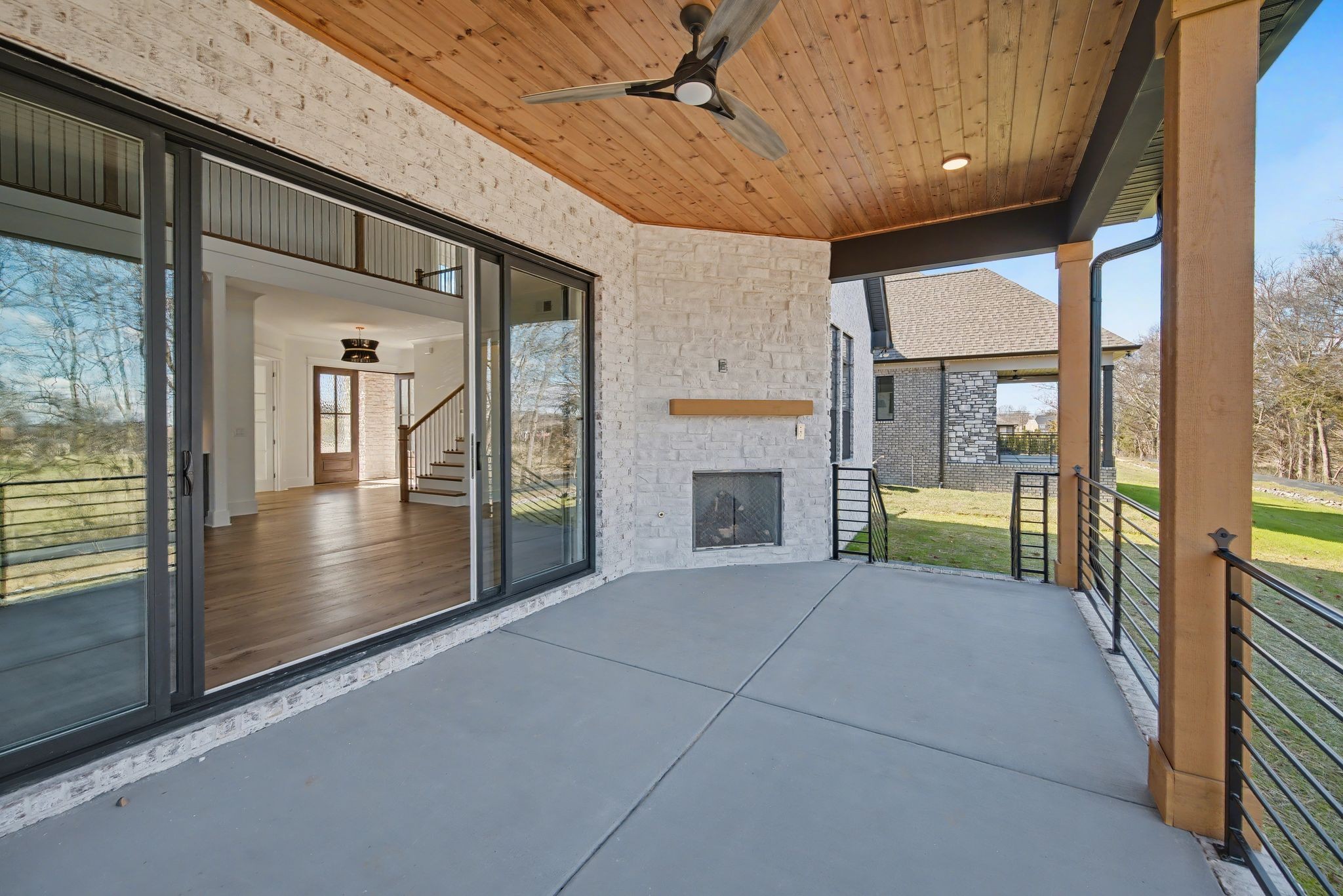 225 Bellsford Road Gallatin, TN 37066 - Photo 53 of 55 a view of a porch with a floor to ceiling window and fire place