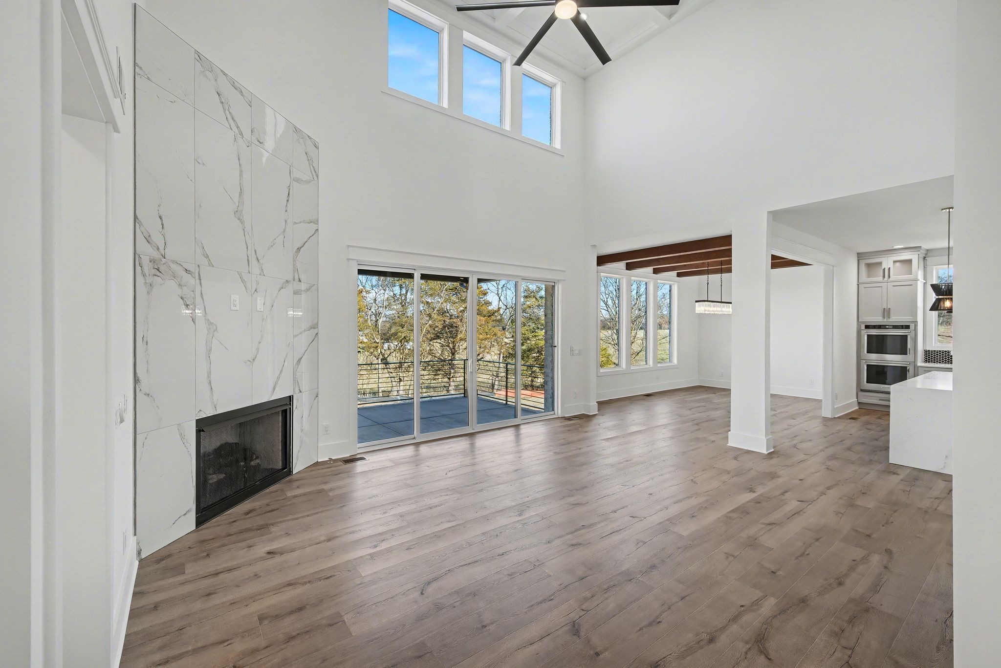 225 Bellsford Road Gallatin, TN 37066 - Photo 10 of 55 a view of a livingroom with wooden floor and a fireplace