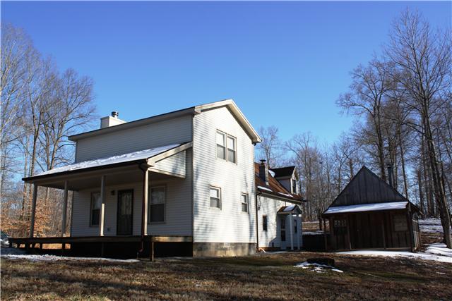 2372 Jarrell Ridge Road Clarksville, TN 37043 - Photo 3 of 18 The other side of the house with another large rocking chair front porch! Notice the rustic workshop next to the house.