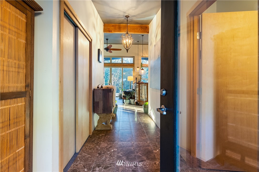 128 Hiline Road Bellingham, WA 98229 - Photo 11 of 27 a hallway with wooden floor windows and bedroom view