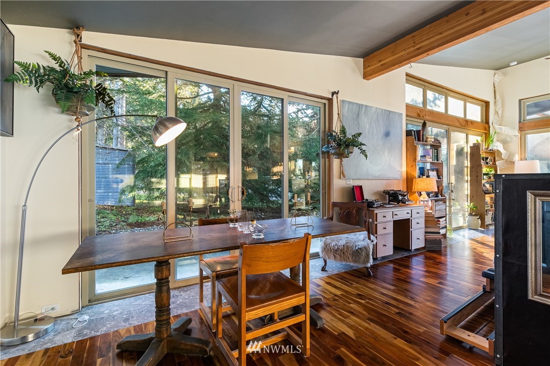 128 Hiline Road Bellingham, WA 98229 - Photo 15 of 27 a living room with large windows table and chairs