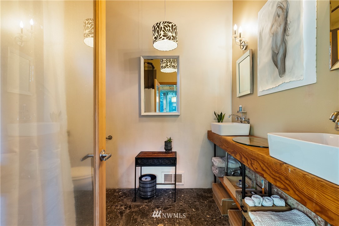 128 Hiline Road Bellingham, WA 98229 - Photo 23 of 27 a bathroom with a sink and a mirror
