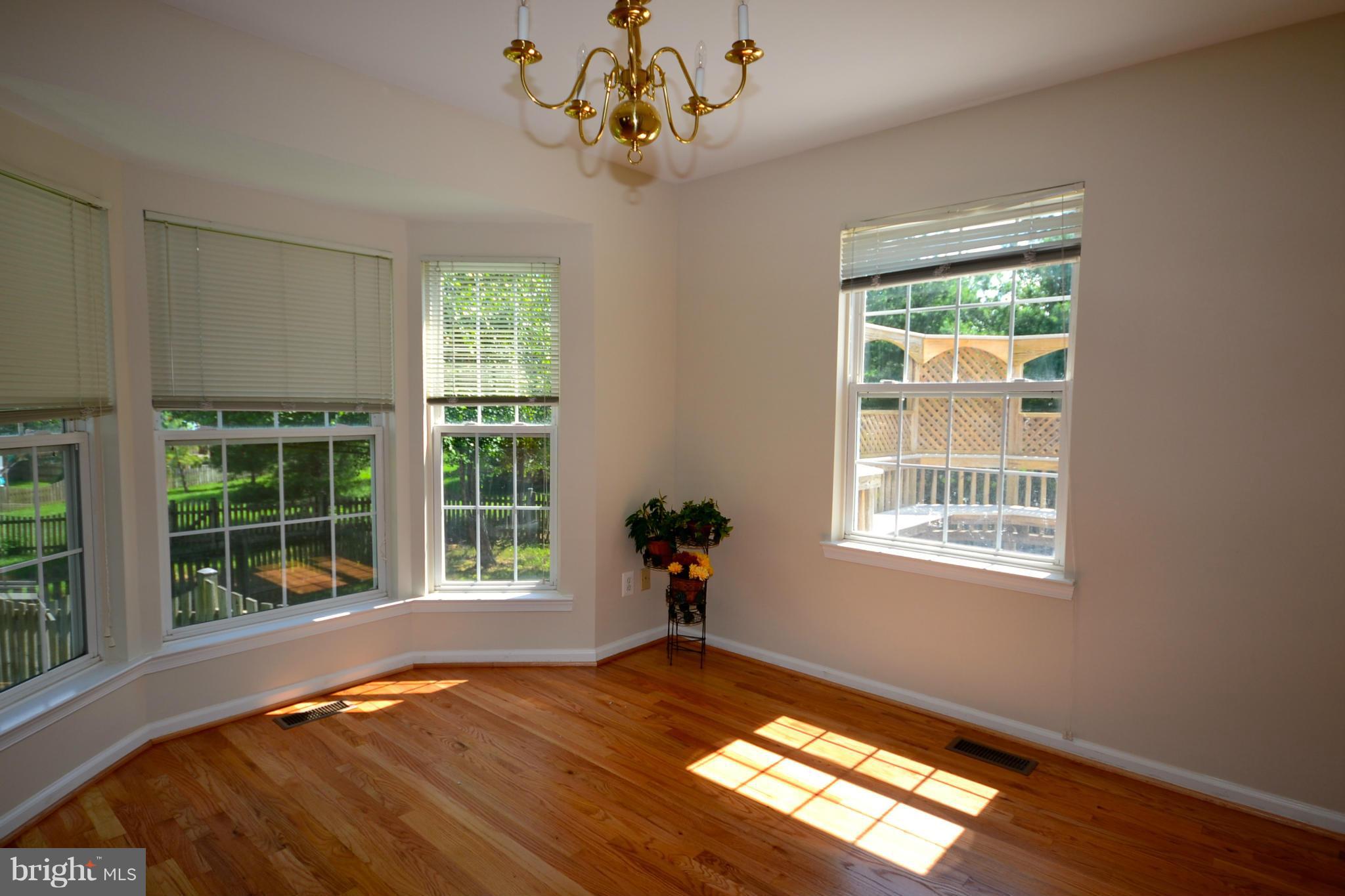 20749 Rainsboro Drive Ashburn, VA 20147 - Photo 6 of 19 Dining Room with Bay Window & Gleaming Hardwoods!