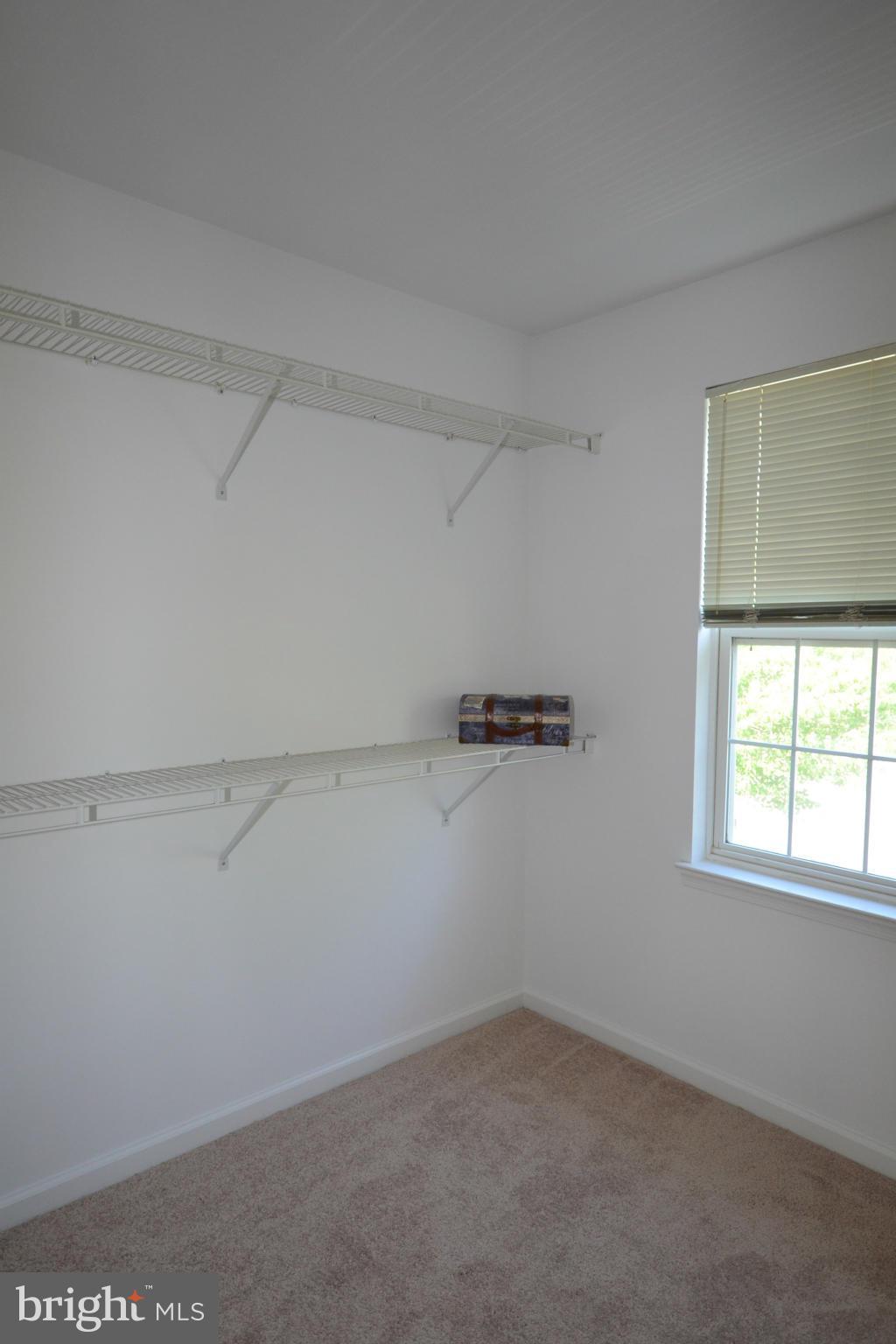 20749 Rainsboro Drive Ashburn, VA 20147 - Photo 9 of 19 Master Closet with Shelves on Both Sides