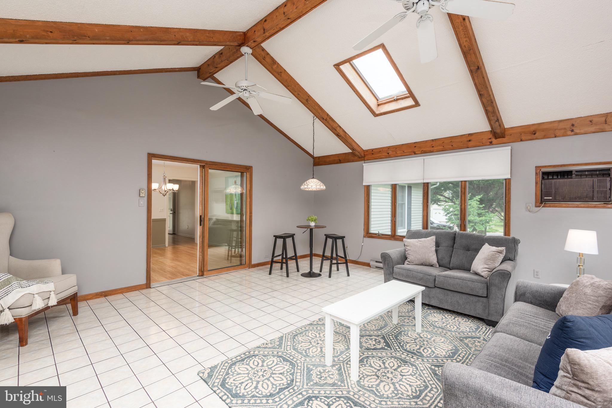 301 Spring Drive Easton, MD 21601 - Photo 15 of 32 a living room with furniture and a flat screen tv