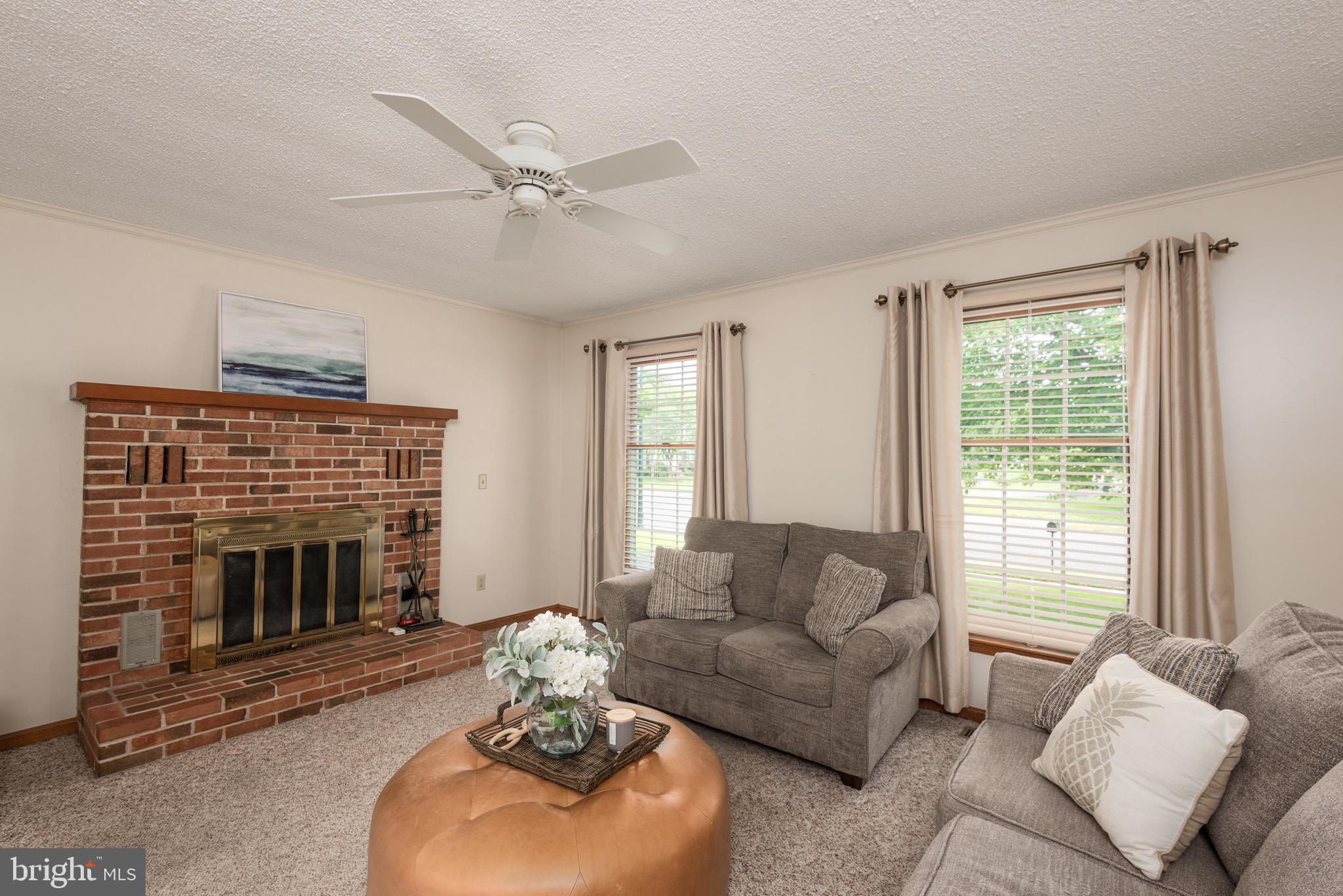 301 Spring Drive Easton, MD 21601 - Photo 17 of 32 a living room with furniture and a fireplace