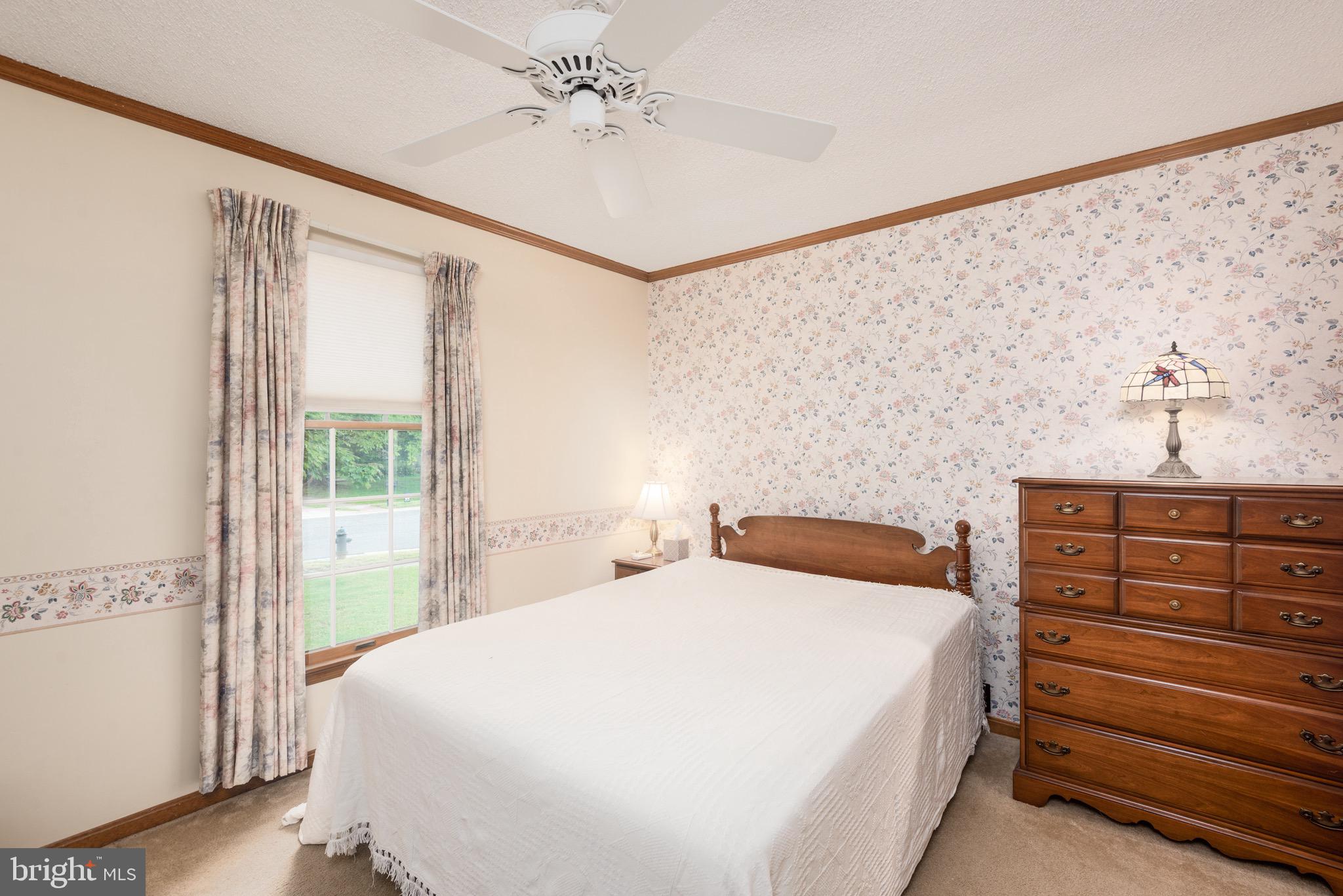 301 Spring Drive Easton, MD 21601 - Photo 26 of 32 a bedroom with a bed and a dresser