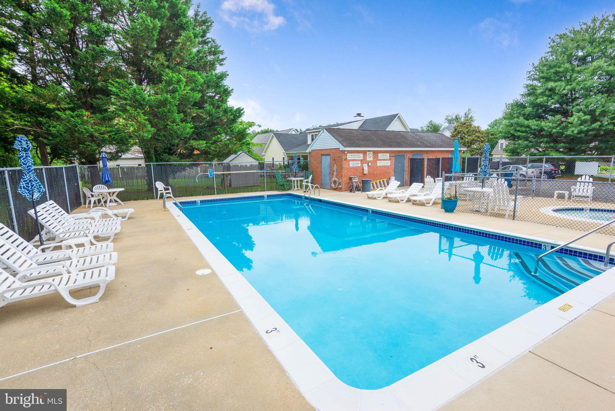 301 Spring Drive Easton, MD 21601 - Photo 31 of 32 a view of a swimming pool with a lounge chair
