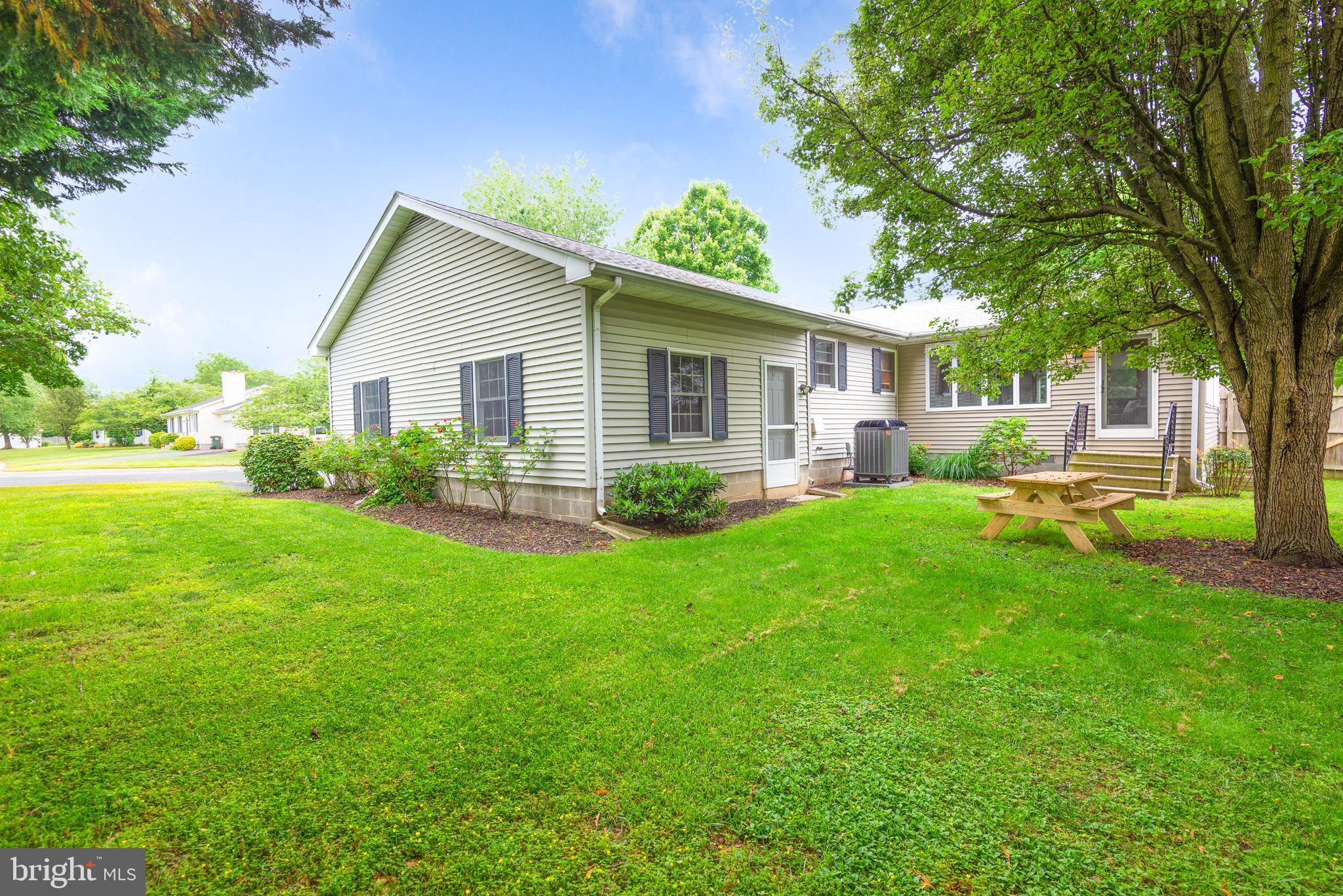 301 Spring Drive Easton, MD 21601 - Photo 5 of 32 a view of a house with a yard and potted plants