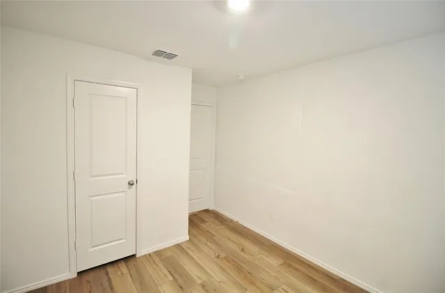 a view of small space with wooden floor