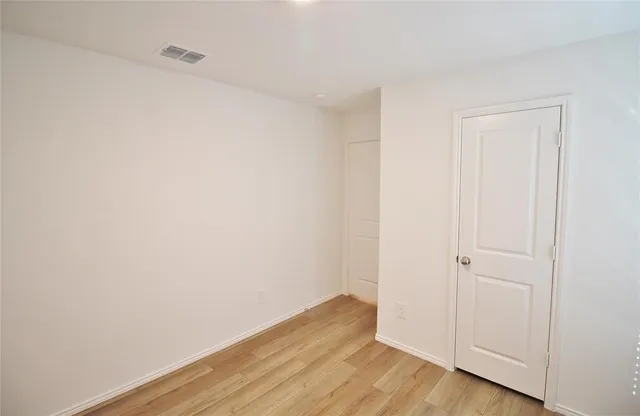 a view of small space with wooden floor