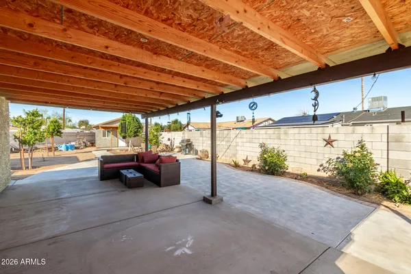 a view of swimming pool with outdoor seating