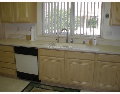 8720 Pennystone Avenue Las Vegas, NV 89134 - Photo 7 of 15 Kitchen. Kichen overlooking rear.