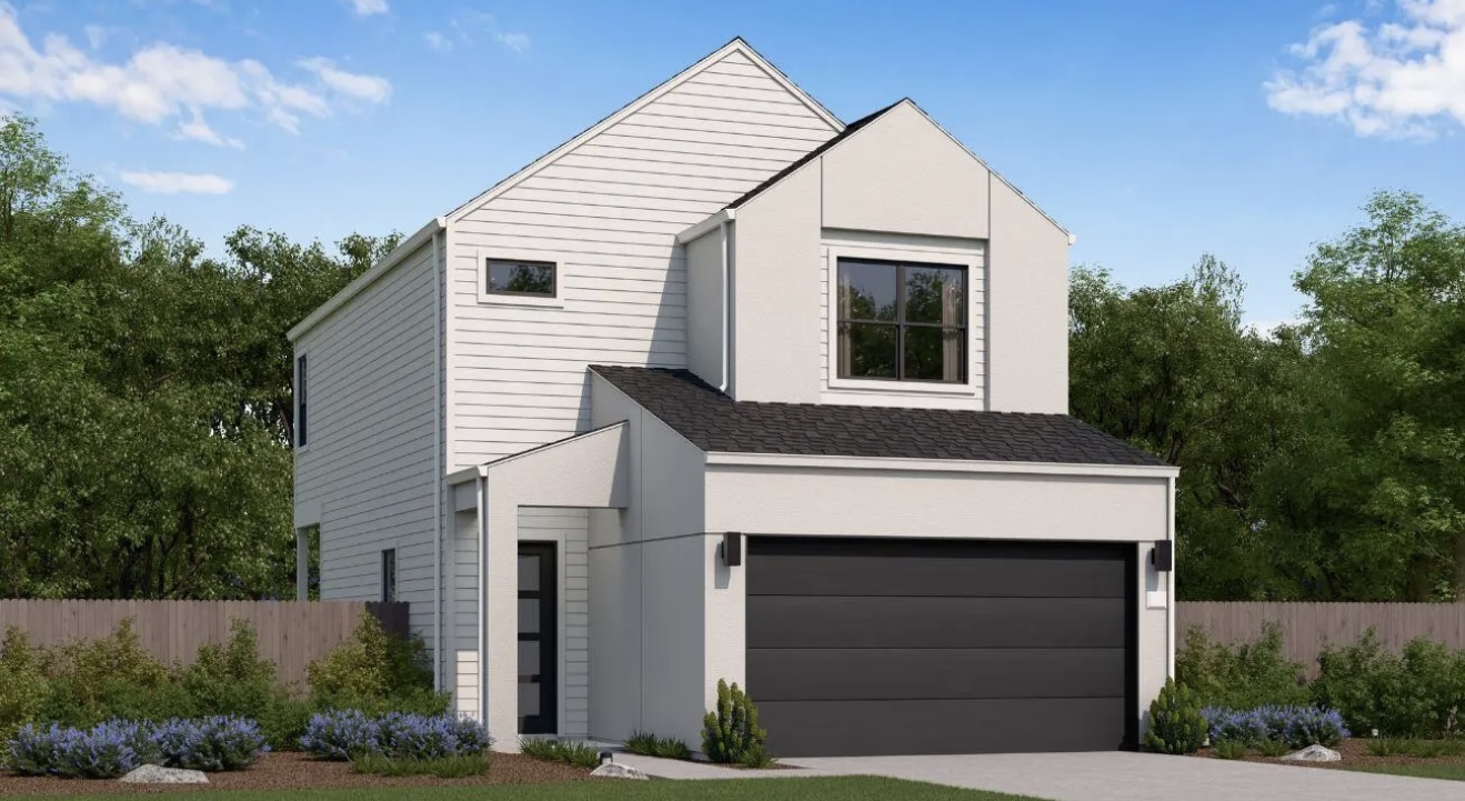 a front view of a house with garage