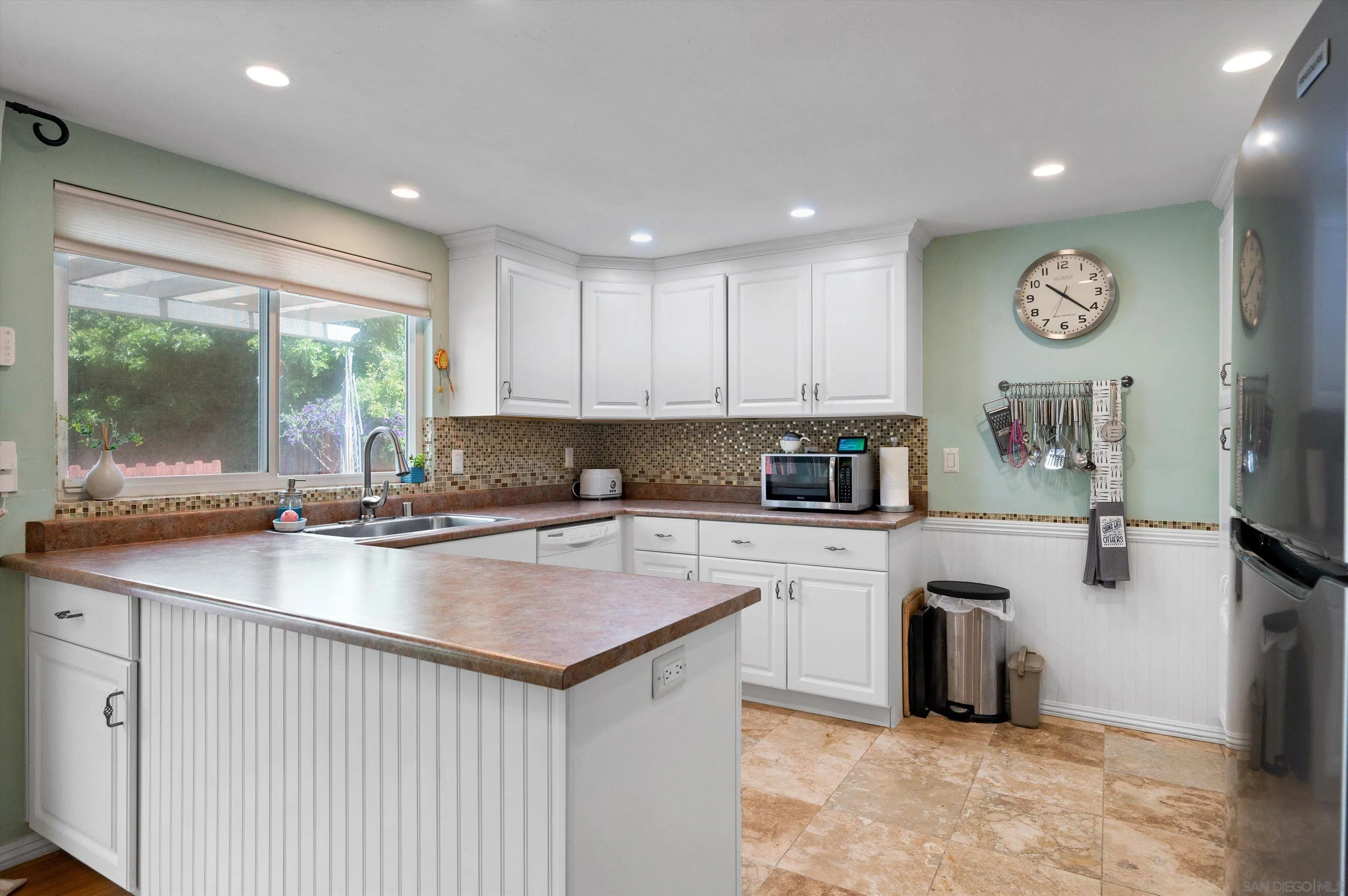 2537 Buena Rosa Fallbrook, CA 92028 - Photo 7 of 20 a kitchen with a sink cabinets and window