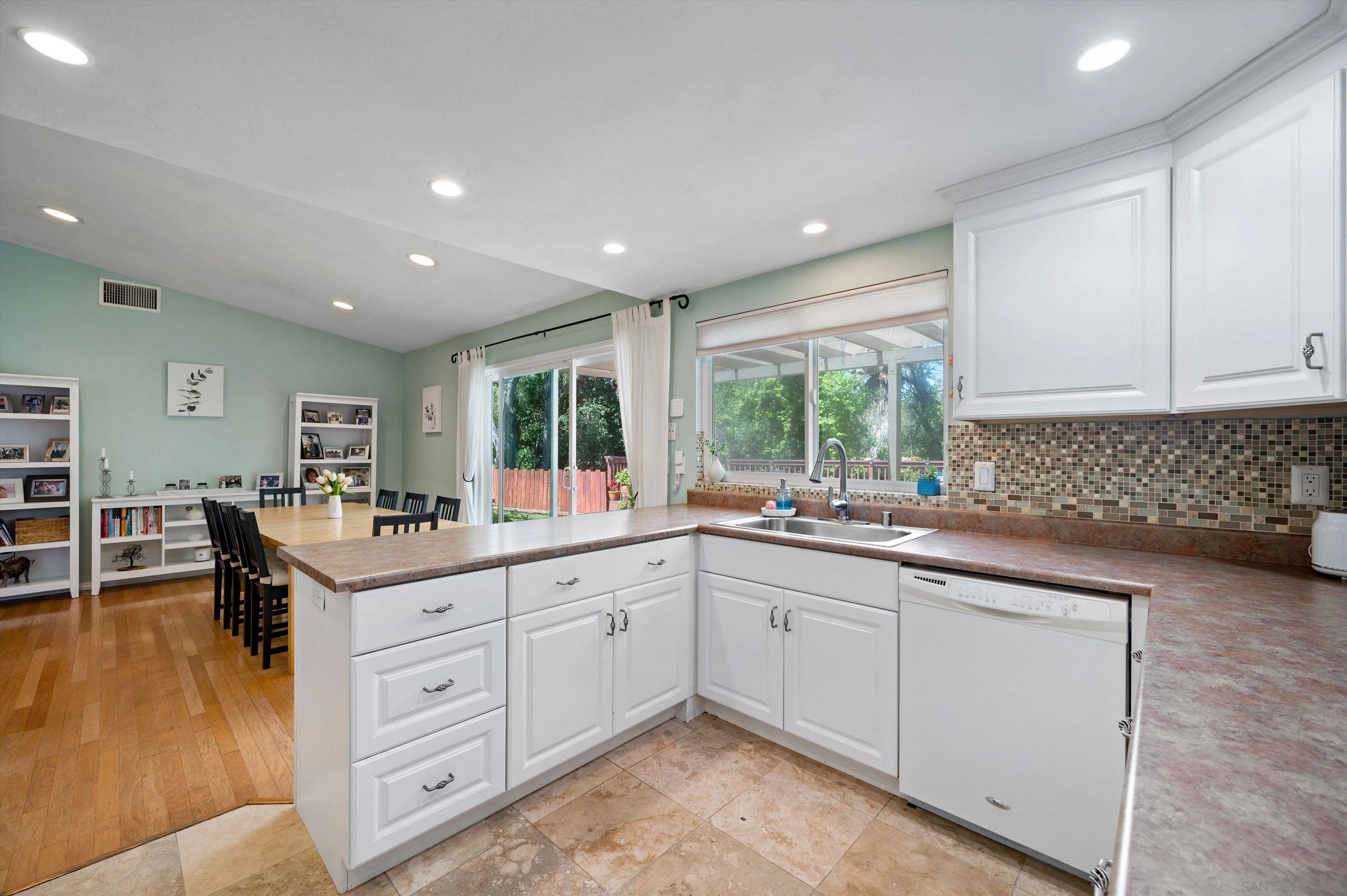 2537 Buena Rosa Fallbrook, CA 92028 - Photo 8 of 20 a kitchen with sink stove and cabinets