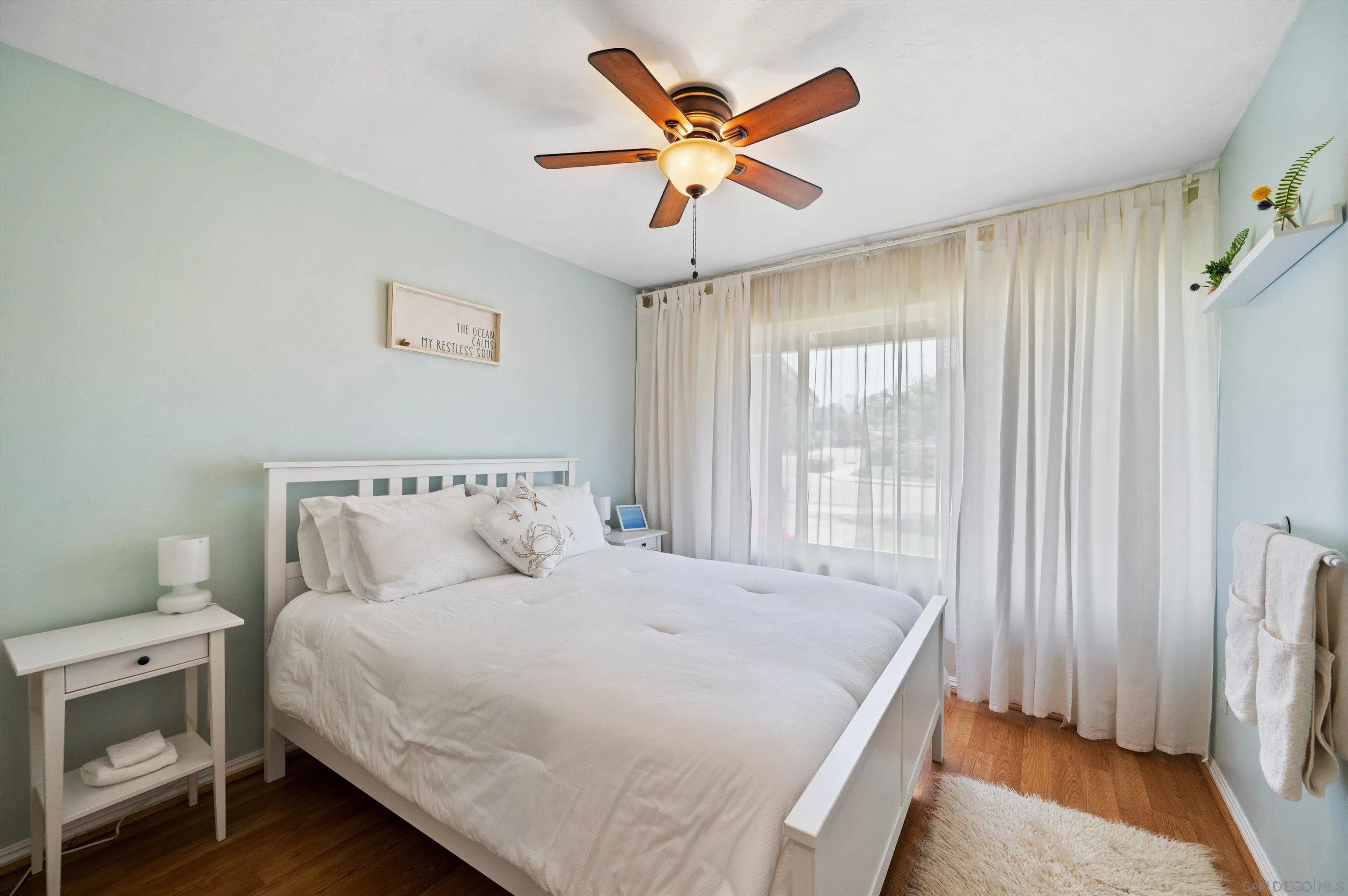 2537 Buena Rosa Fallbrook, CA 92028 - Photo 9 of 20 a bedroom with a bed and a ceiling fan