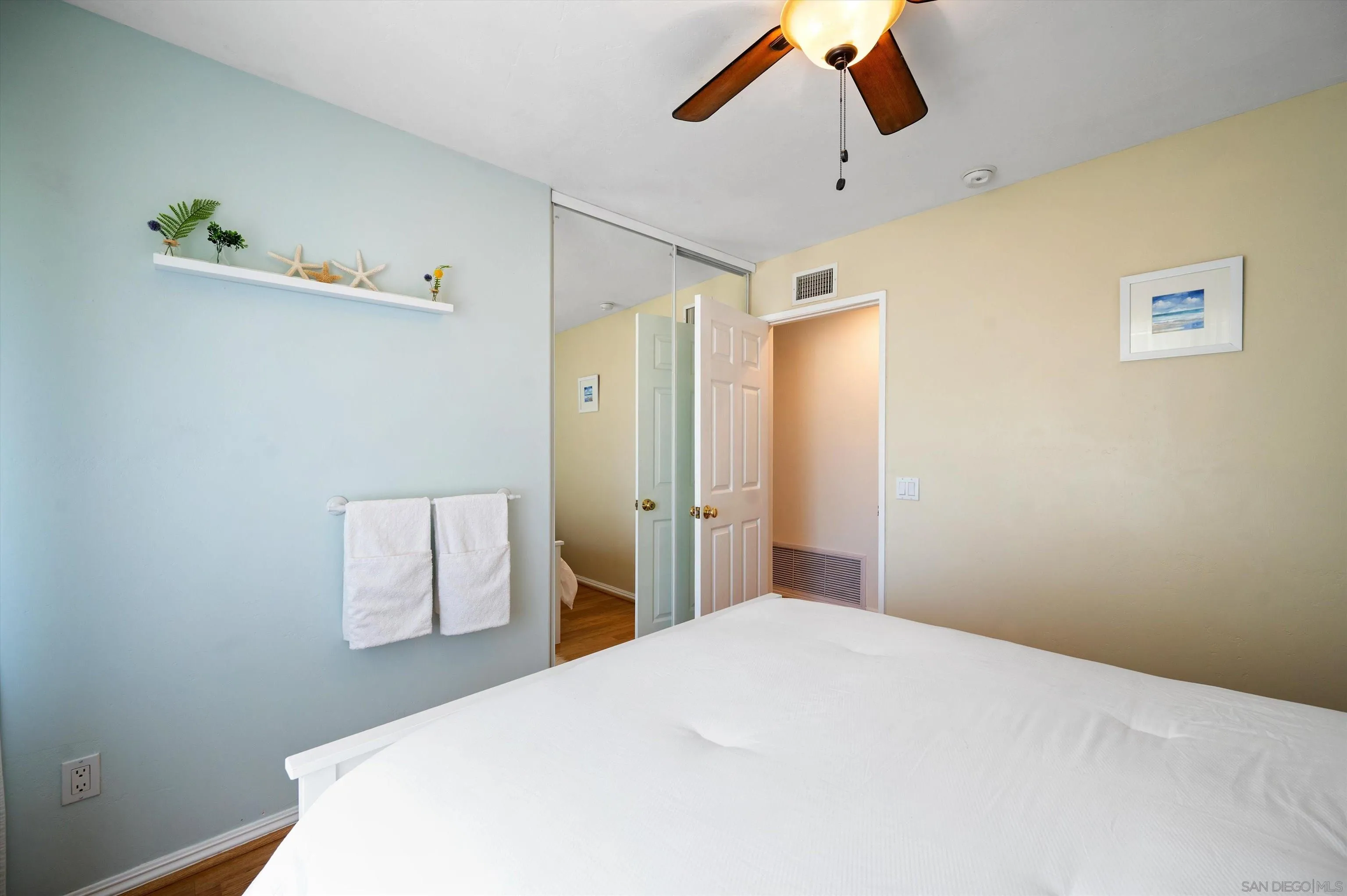 2537 Buena Rosa Fallbrook, CA 92028 - Photo 10 of 20 a bedroom with a bed and a chandelier