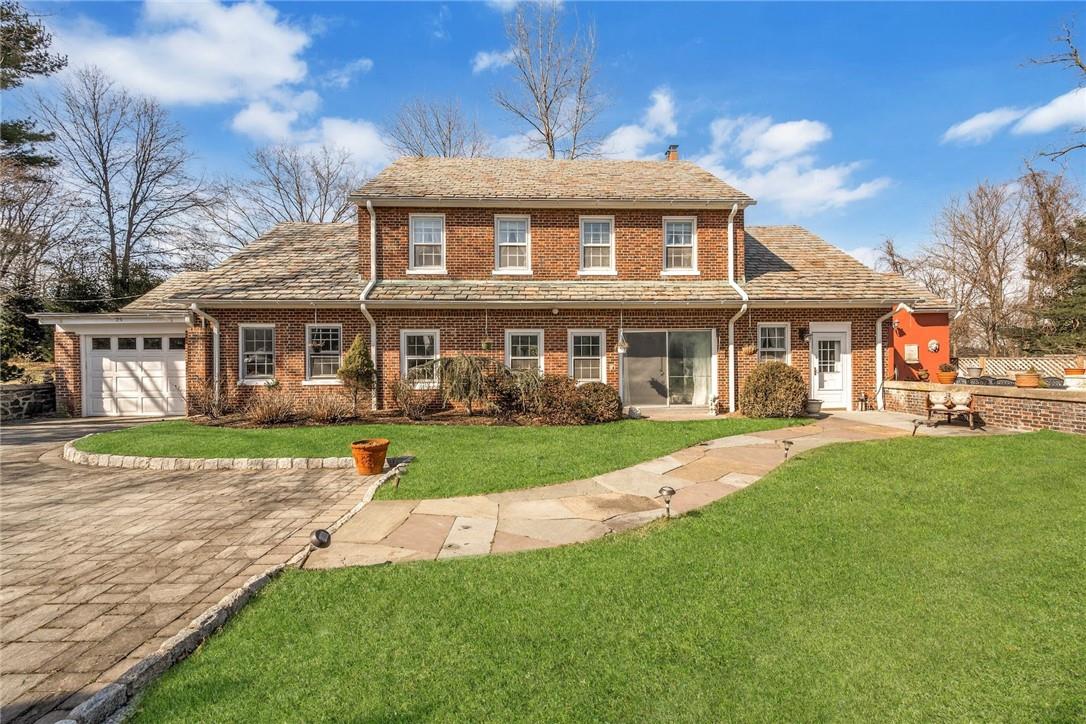 front view of a house next to a yard