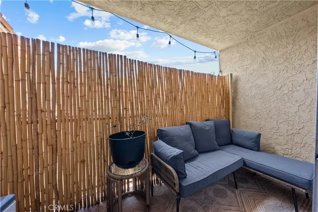 a couch sitting in a room next to a window