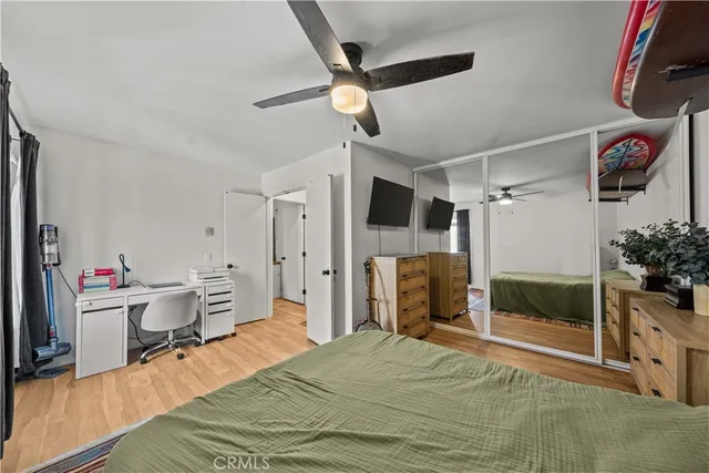 a bedroom with a bed and a fireplace