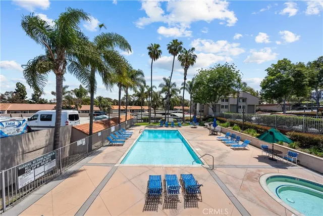 a view of swimming pool with sitting area