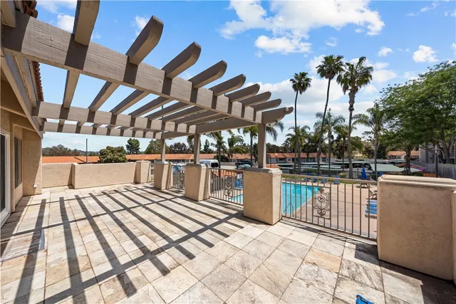 a view of a patio with swimming pool