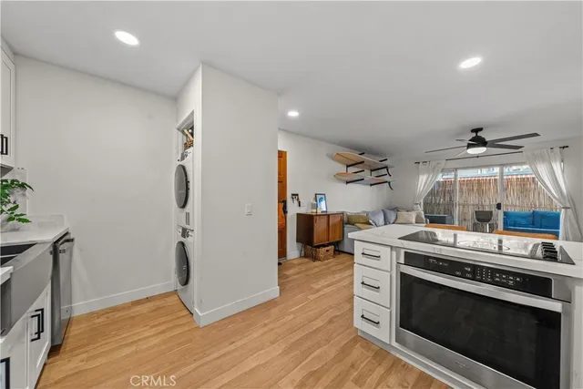 a kitchen with a stove and a refrigerator