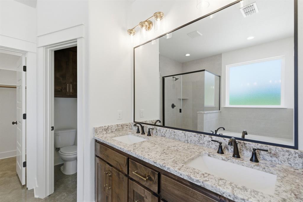 109 Graystone Weatherford, TX 76088 - Photo 19 of 26 a bathroom with a granite countertop sink and a mirror