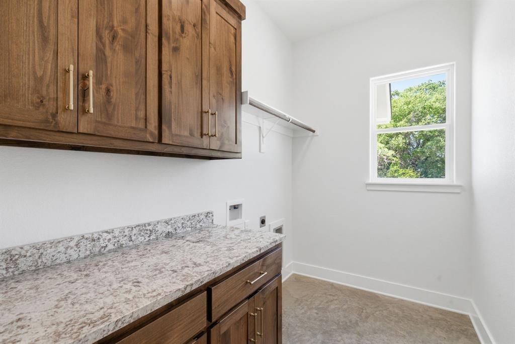 109 Graystone Weatherford, TX 76088 - Photo 24 of 26 a view of cabinets with wooden floor