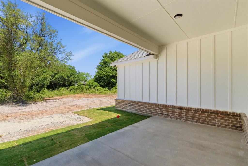 109 Graystone Weatherford, TX 76088 - Photo 25 of 26 a view of a backyard with potted plants