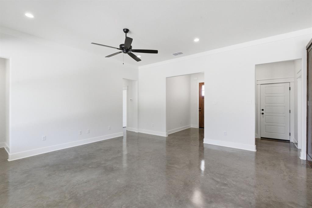 109 Graystone Weatherford, TX 76088 - Photo 10 of 26 wooden floor in an empty room with a window