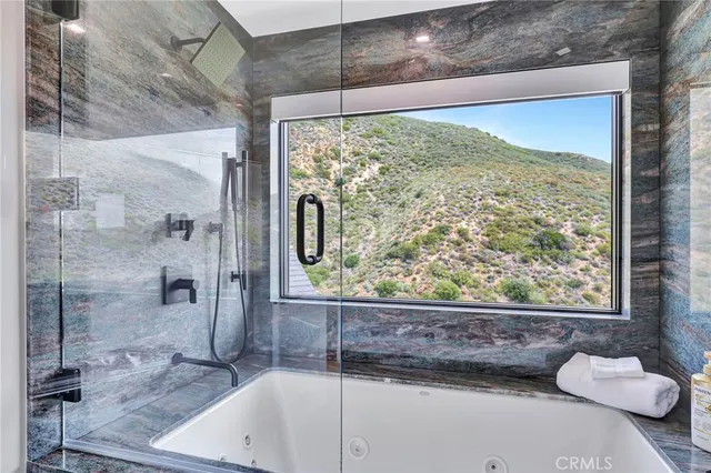 a bedroom with a bed and a lamp on table