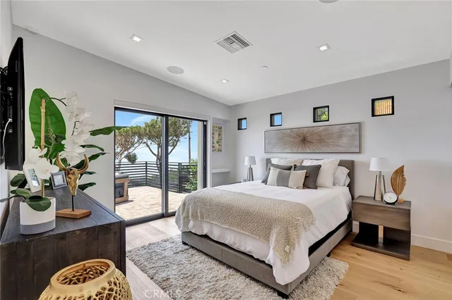 a bathroom with a granite countertop shower sink and mirror