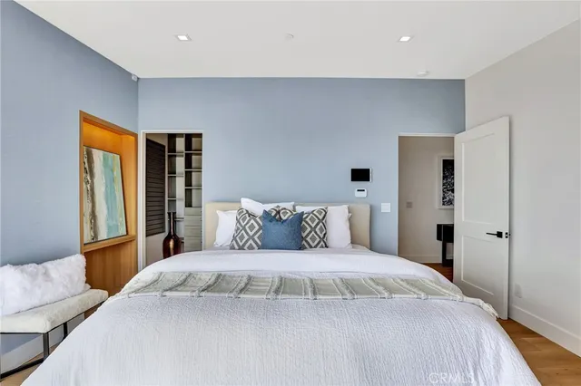 a bathroom with double vanity sink a mirror and a shower