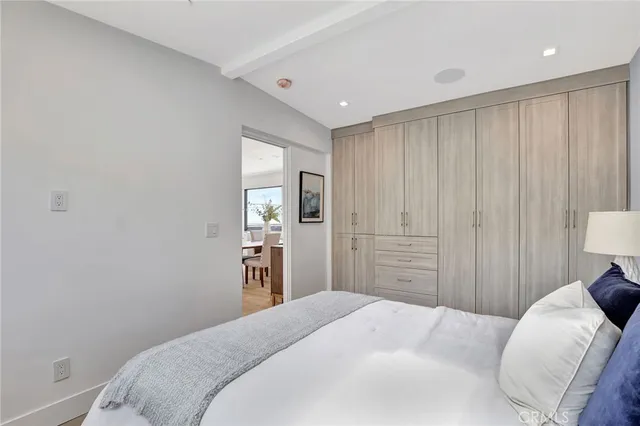 a living room with a flat screen tv and a floor to ceiling window