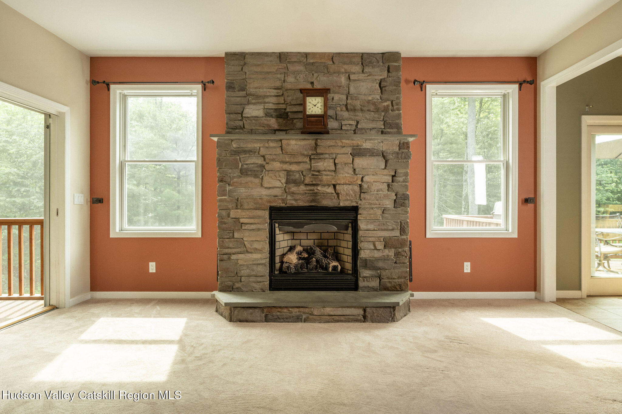 214 Wright Road Kerhonkson, NY 12446 - Photo 24 of 50 a living room with a fireplace and windows